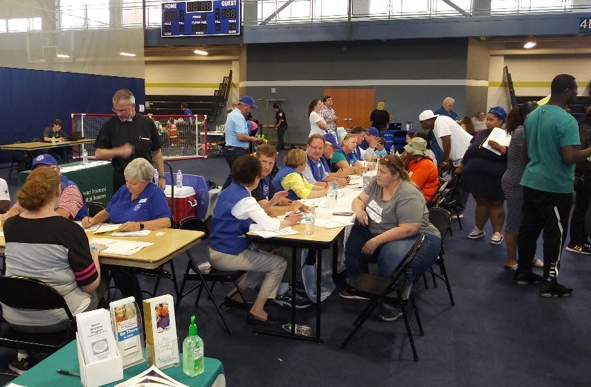 St. Louis and Central Missouri volunteers from the Society of St. Vincent de Paul assist victims of a May 22 tornado during a Multi-Agency Resource Center (MARC) event in Jefferson City.